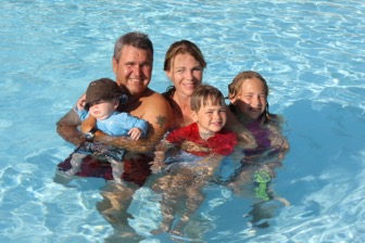 Family of five in a swimming pool